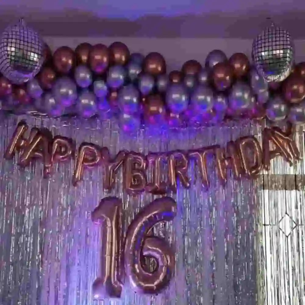 Birthday disco theme decor with disco balls and fringe