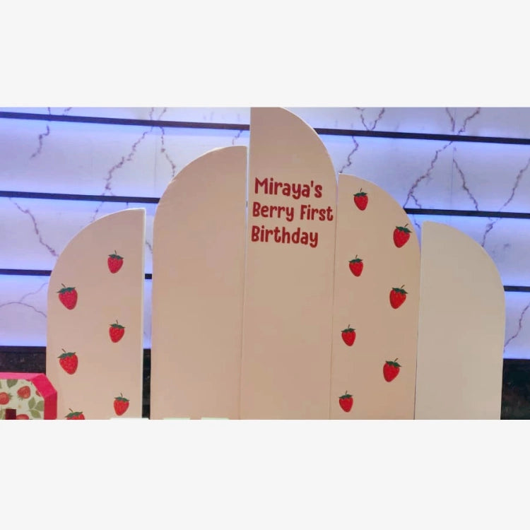 Book Berry First Birthday Decor with personalised strawberry-themed backdrop panels and birthday name display