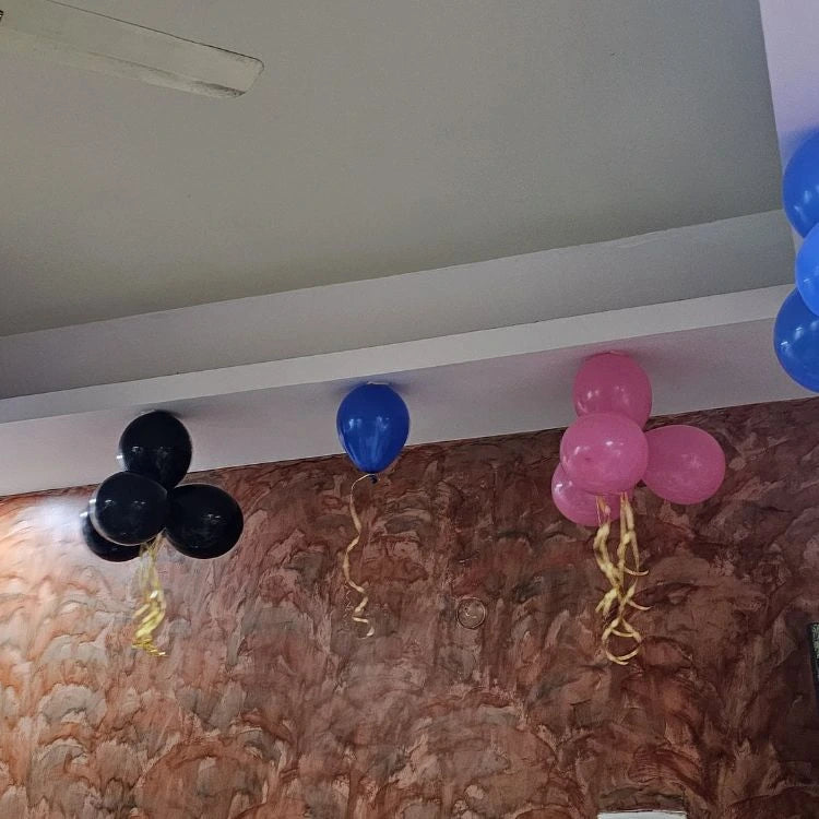 Get birthday balloon bunch decoration at home with blue pink and black balloons