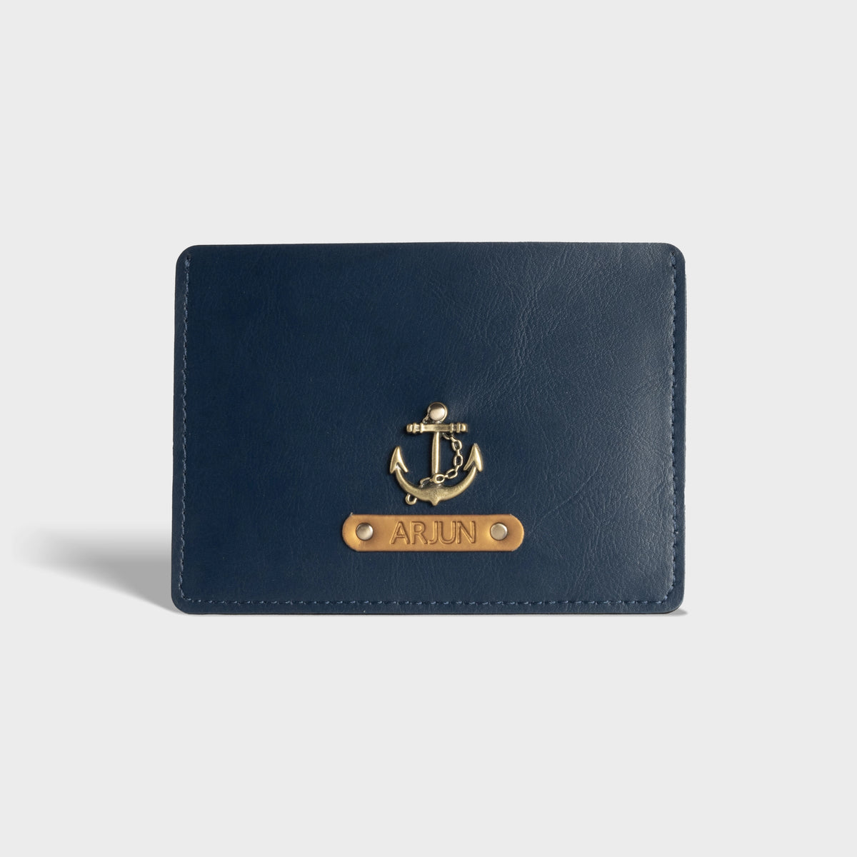 Shop blue personalized passport cover with customised charm and name plaque
