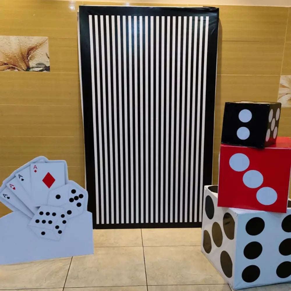 Book Card Theme Set Up with printed card backdrop, oversized dice and casino-style party props for Diwali decor