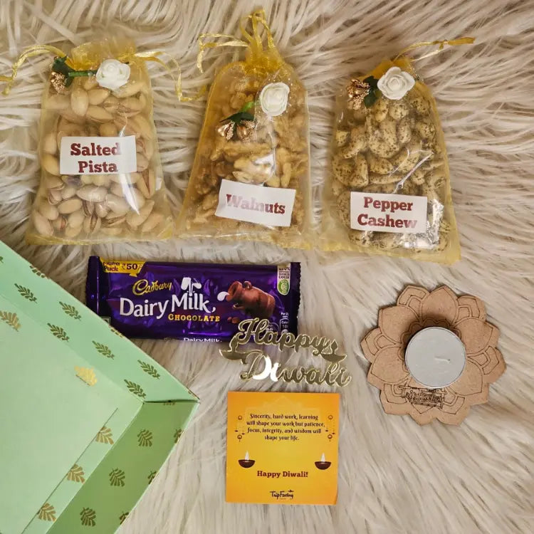 Shop Diwali dry fruit hamper with salted pista, walnuts, pepper cashews and chocolate
