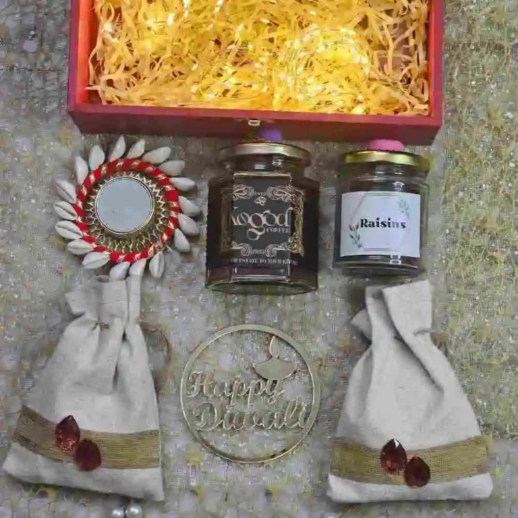 Shop Diwali gift hamper featuring dry fruits, coffee and festive decor Online