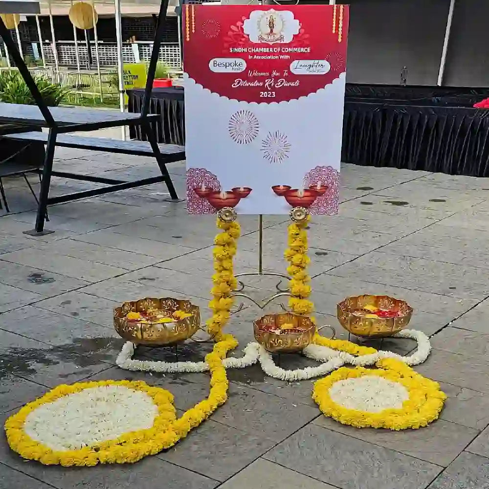 Get Diwali Decor in Office with floral rangoli, traditional diyas and festive welcome board decoration