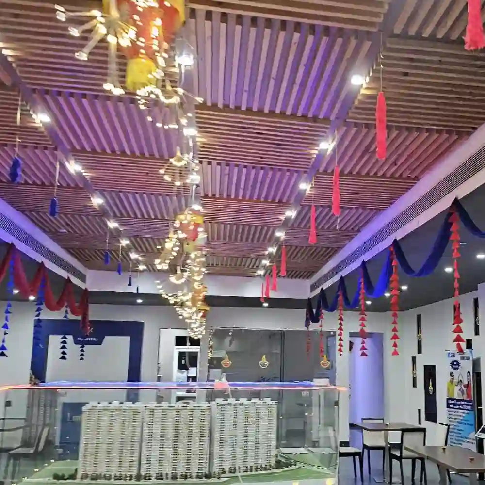 Order Diwali Decor in Office with red fabric hangings, decorative lights and traditional lanterns