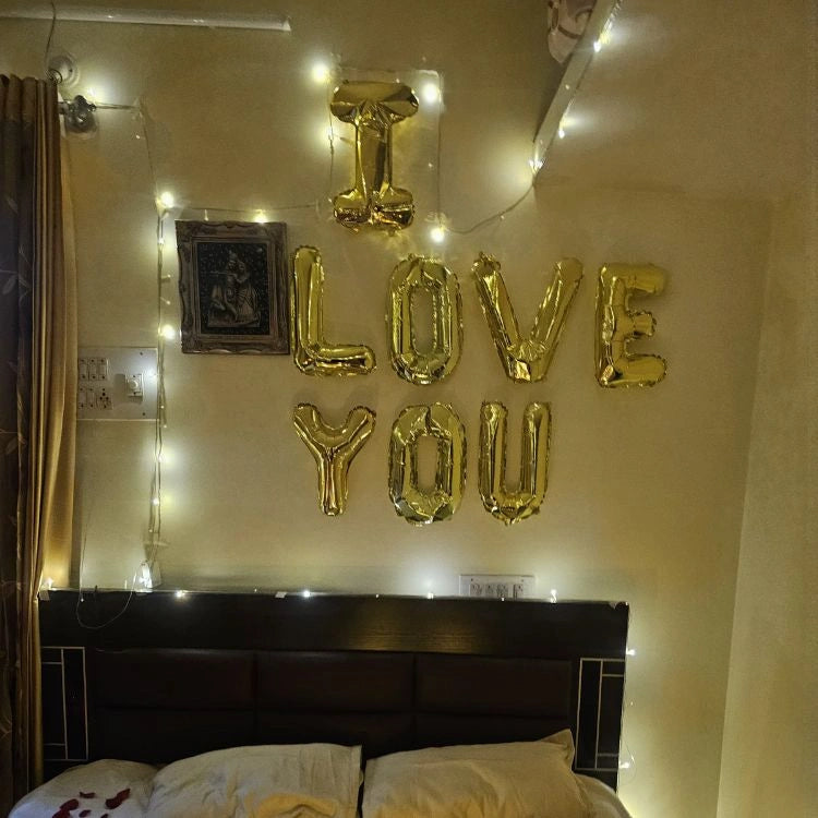 Enquire about first night room decoration with I Love You balloons and lights