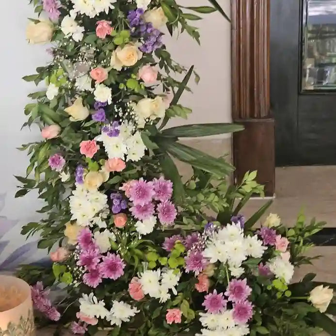 Book floral welcome board with roses, chrysanthemums and mixed flowers