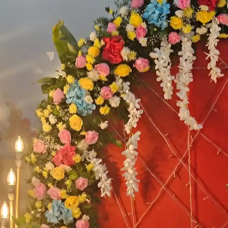 Book Ganesh Chaturthi floral backdrop decoration with hanging flower garlands
