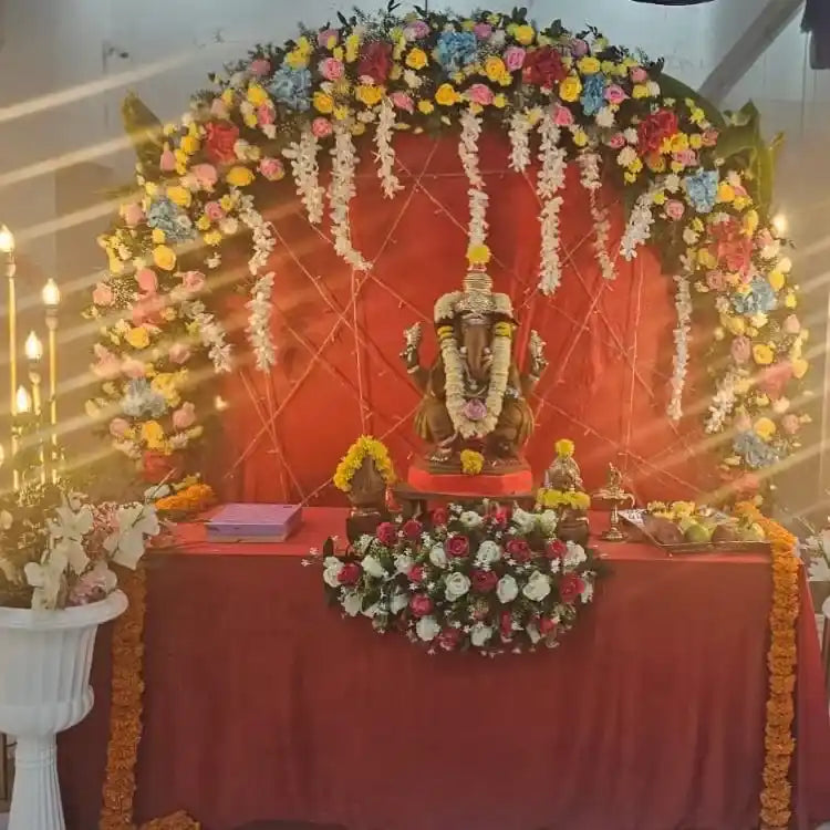 Enquire about Ganesh Chaturthi mandap backdrop with floral and lighting decor