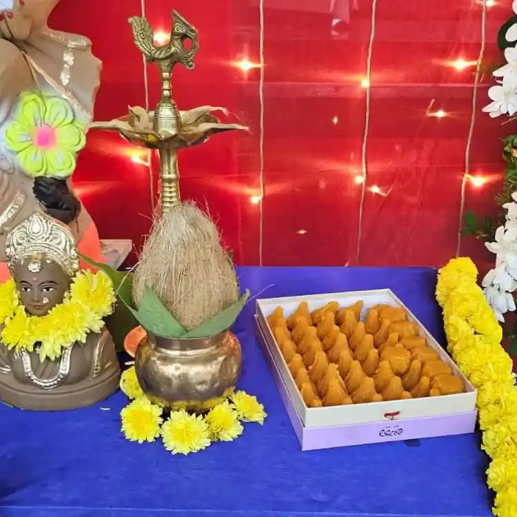 Enquire about Ganesh Chaturthi puja table decoration with flowers and diya