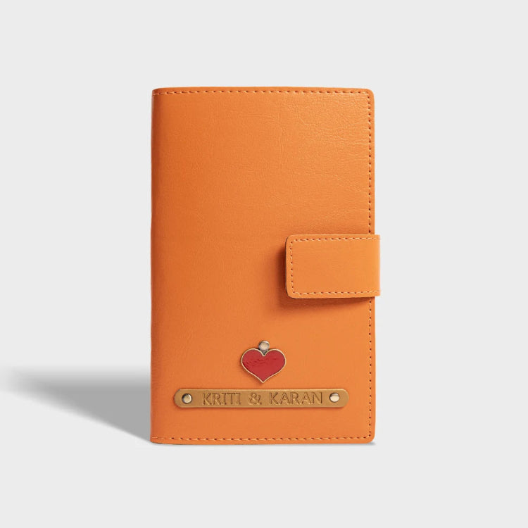 Order orange personalized dual passport cover with customised charms designs