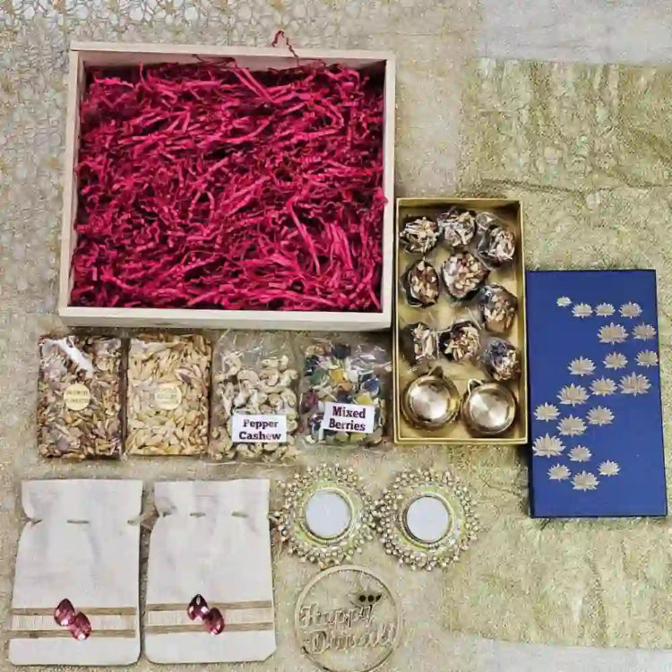 Buy Sweet Delicacy Diwali Hamper with dry fruit treats and festive diyas