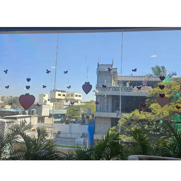 Order Valentine's Day glass window decoration with heart cutouts for events